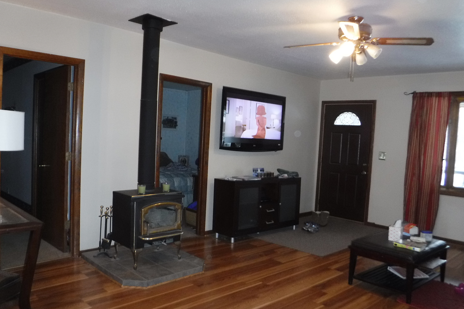 14447 Ridgeway Avenue Midlothian, IL 60445 - Photo 11 of 21 a living room with furniture and a flat screen tv