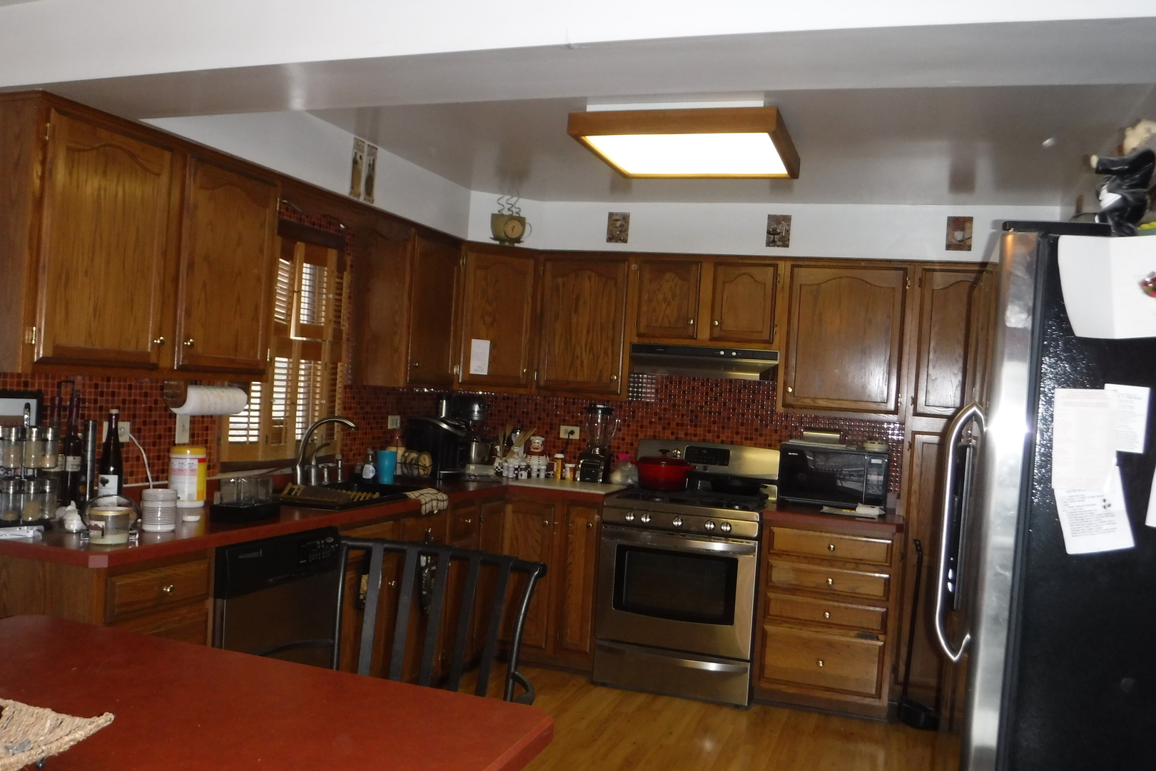 14447 Ridgeway Avenue Midlothian, IL 60445 - Photo 4 of 21 a kitchen with a refrigerator and cabinets