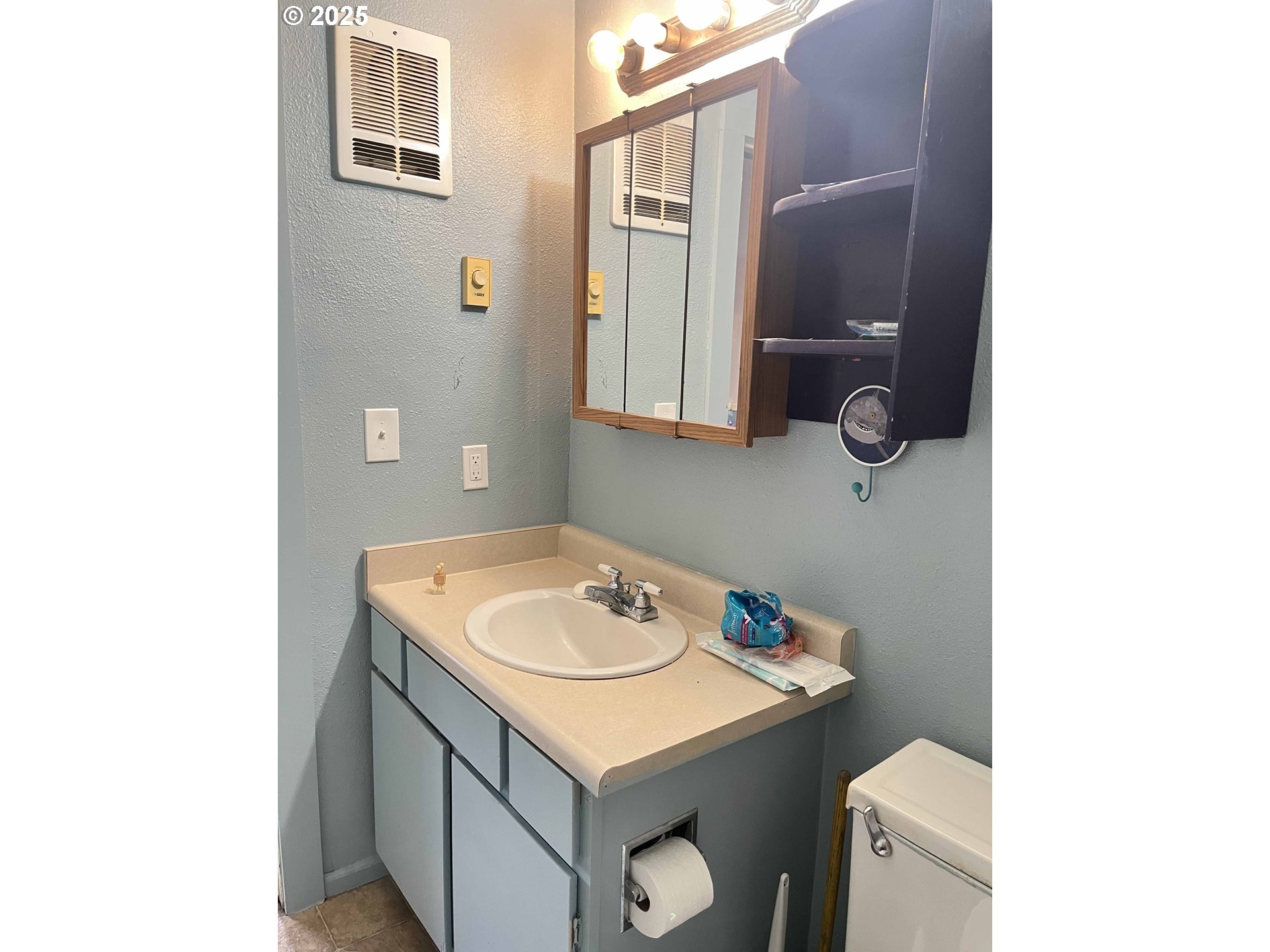 1260 10th Street, Unit 23 Florence, OR 97439 - Photo 11 of 19 a bathroom with a sink and a toilet