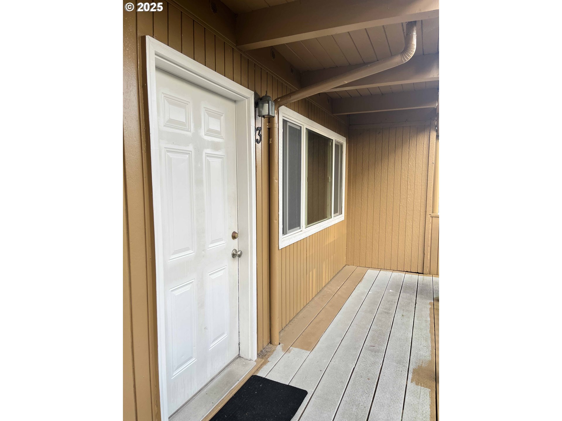 1260 10th Street, Unit 23 Florence, OR 97439 - Photo 4 of 19 a view of a hallway with wooden floor