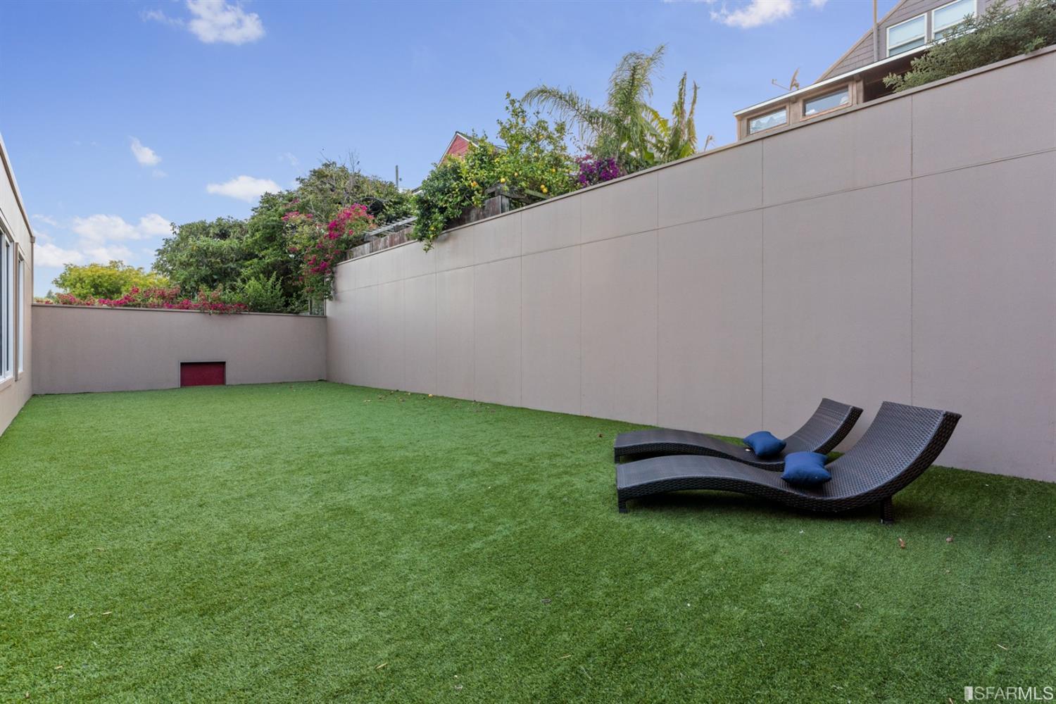 172 Prentiss Street San Francisco, CA 94110 - Photo 16 of 73 Soccer pitch made with astroturf and bordered by concrete walls on all four sides.