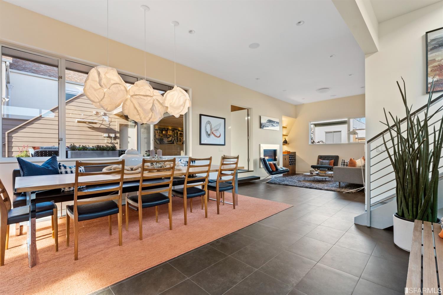 172 Prentiss Street San Francisco, CA 94110 - Photo 25 of 73 Formal dining room with designer light fixtures (Clouds) by Frank Gehry