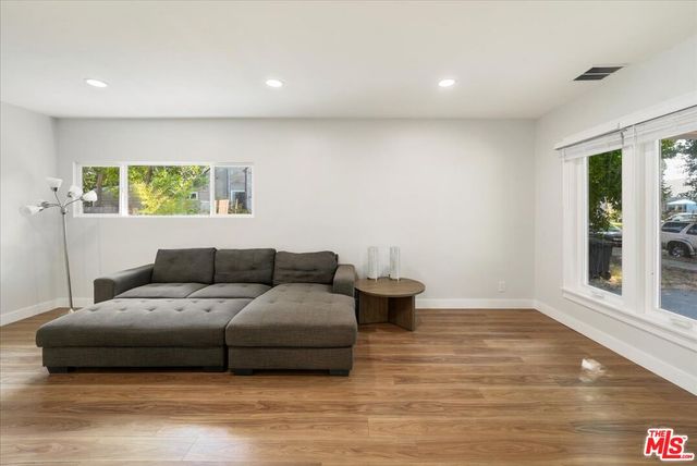 a living room with furniture and window