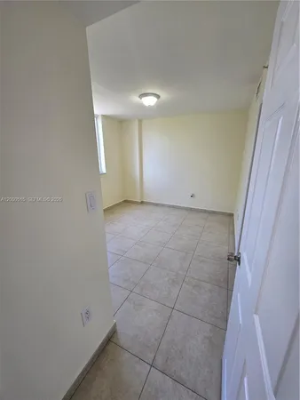 an empty room with a bathroom