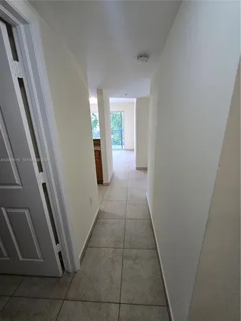 a hallway with sliding door and porch