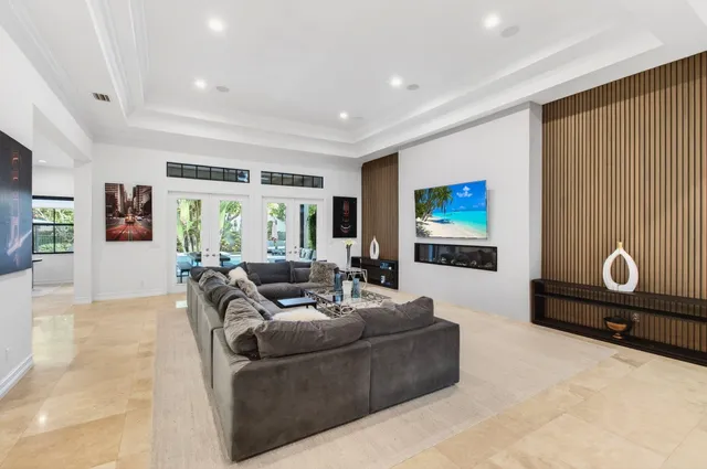 a kitchen with stainless steel appliances kitchen island granite countertop a sink and cabinets