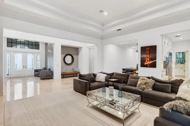 a bathroom with a granite countertop sink a toilet and a shower