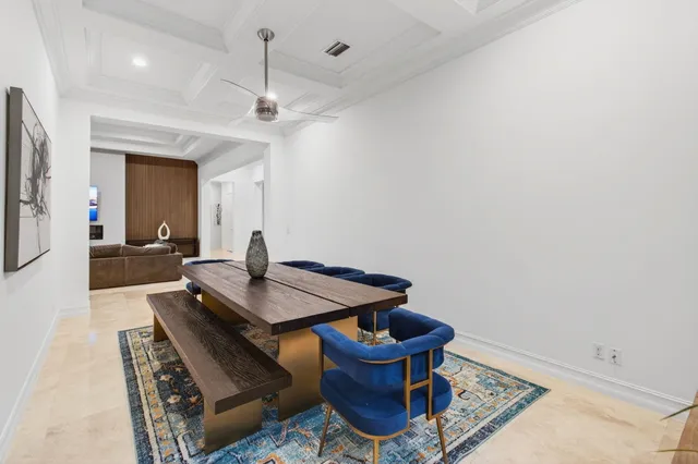a spacious bathroom with a granite countertop sink a toilet a mirror and bathtub