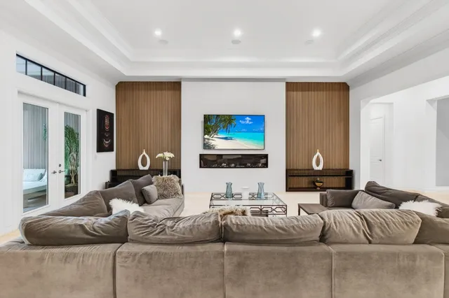 a bathroom with a granite countertop sink a mirror and a bathtub