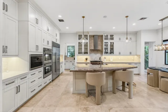 a bathroom has pair of shower