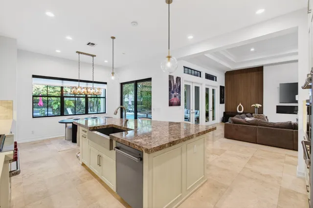 a living room with furniture a rug and a window