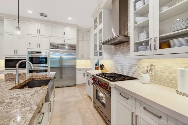 a bedroom with a bed and a potted plant