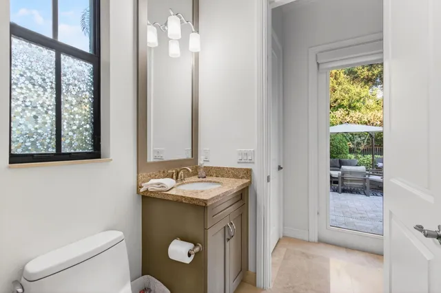 a view of yard with swimming pool and sitting area