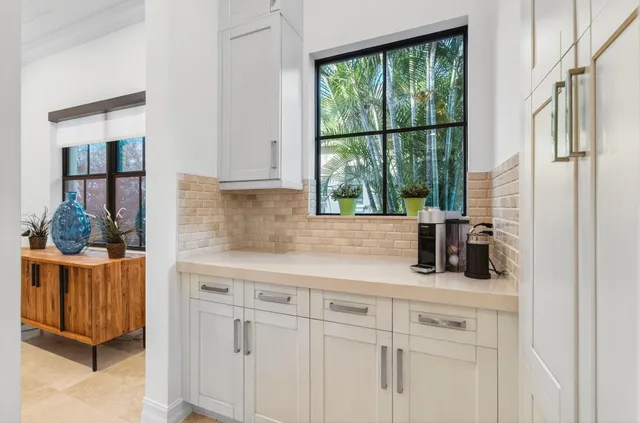 a view of a house with swimming pool and sitting area