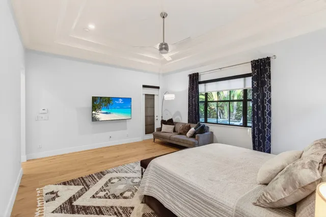 a view of a house with swimming pool and sitting area