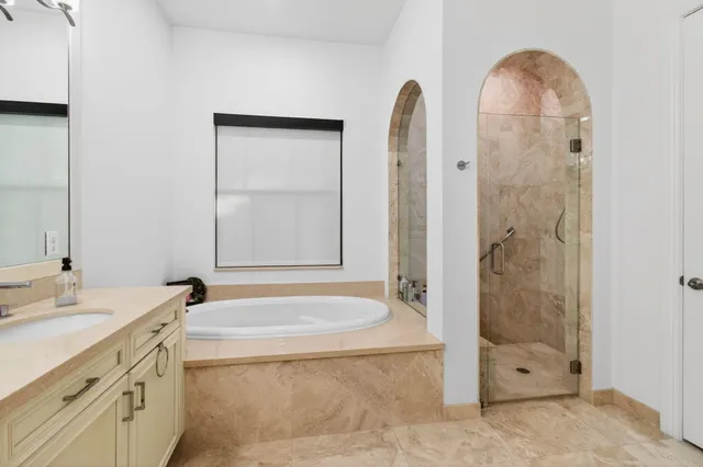 an aerial view of residential houses with outdoor space and street view