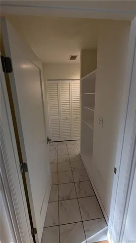 a view of empty room with windows