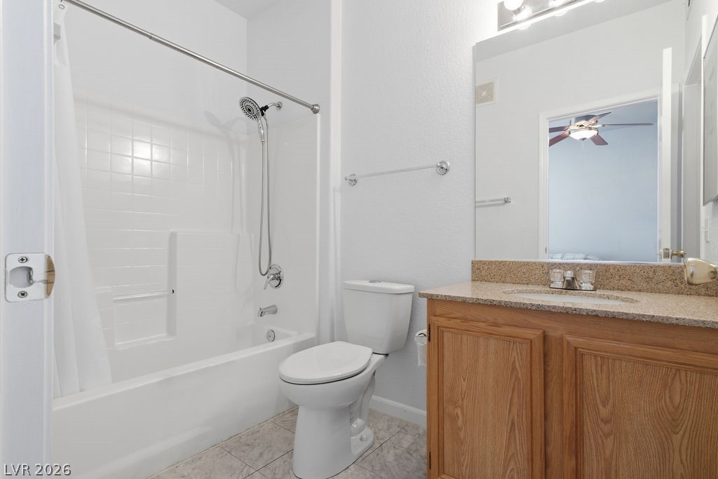 10550 West Alexander Road, Unit 2133 Las Vegas, NV 89129 - Photo 25 of 42 This bright bathroom features a vanity with granite counters and a tiled floor, creating a clean aesthetic.