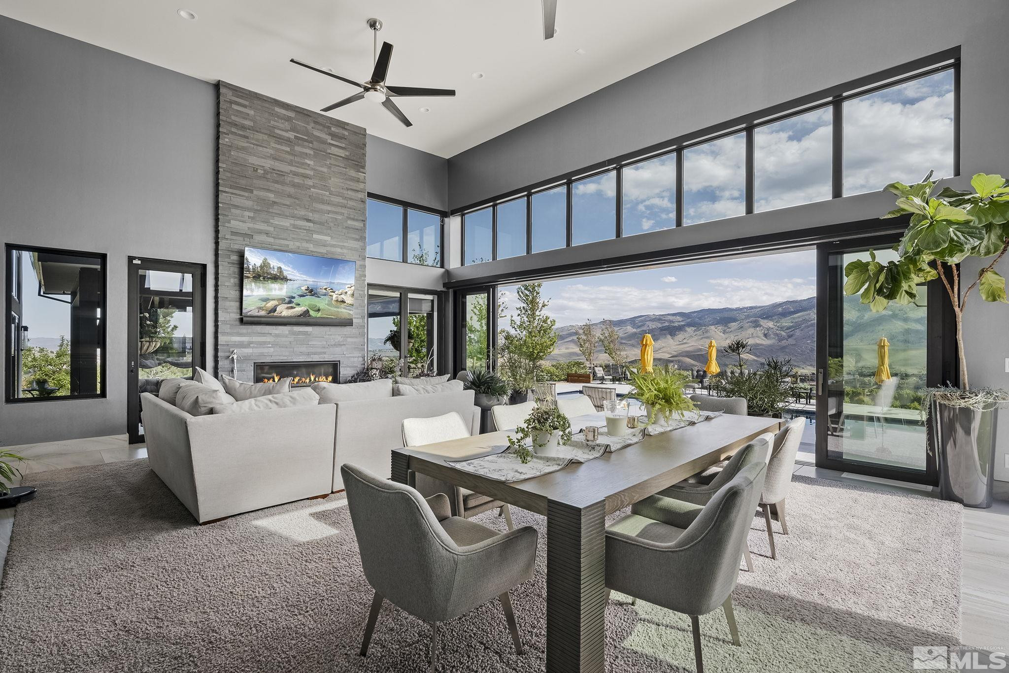 2385 Eagle Bend Trail Reno, NV 89523 - Photo 17 of 40 a dining room with furniture a rug and a floor to ceiling window