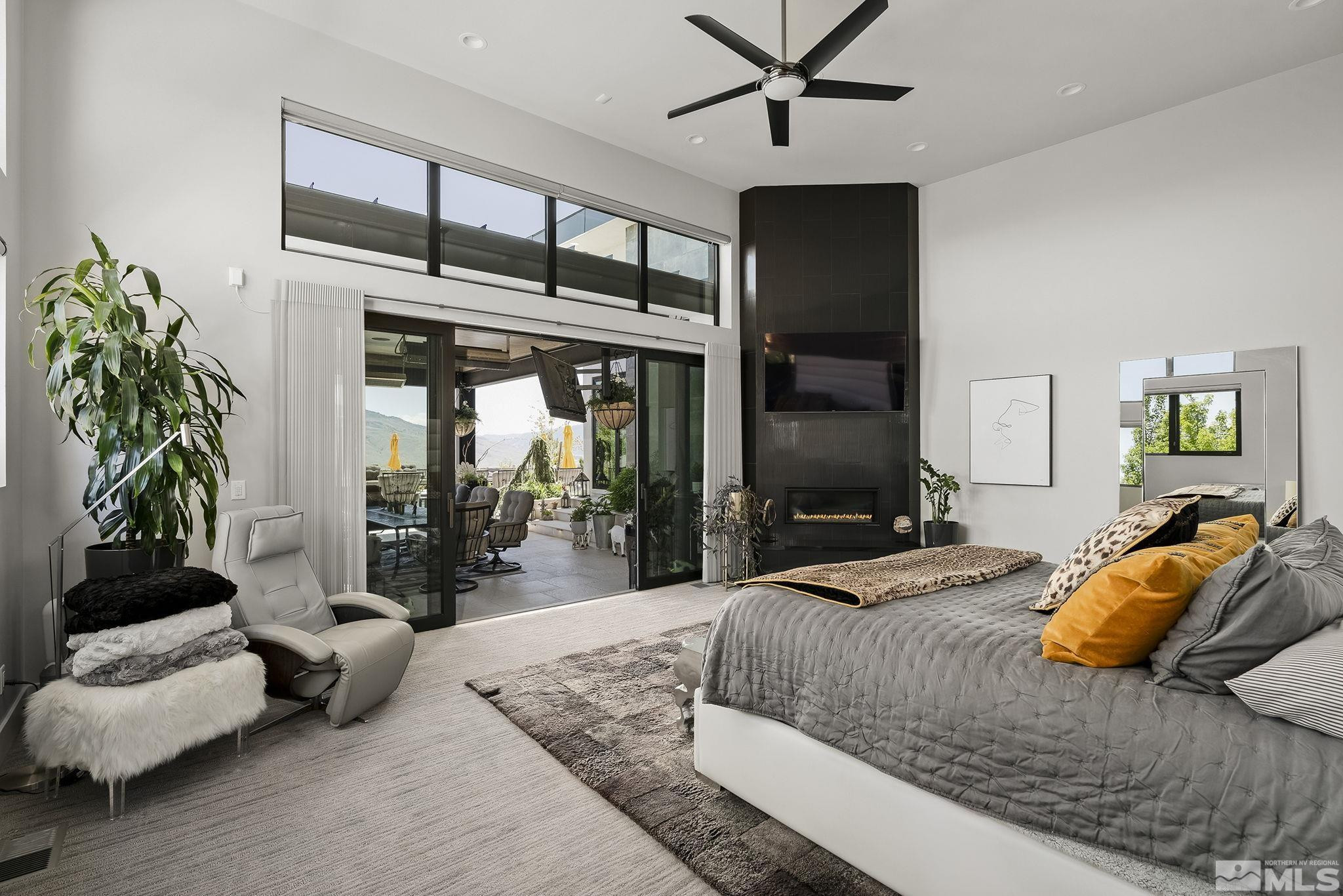 2385 Eagle Bend Trail Reno, NV 89523 - Photo 19 of 40 a bedroom with a bed and ceiling fan