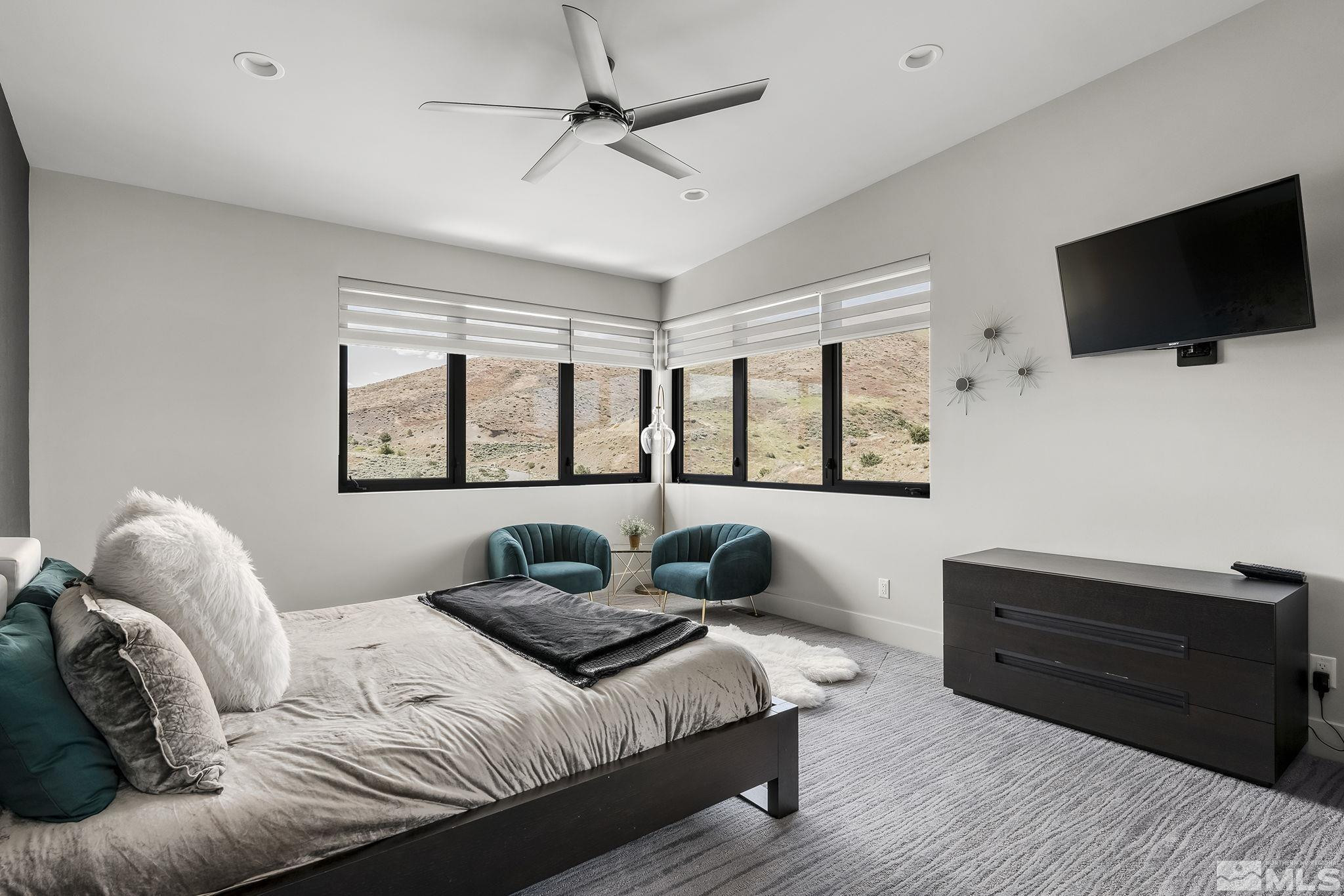 2385 Eagle Bend Trail Reno, NV 89523 - Photo 28 of 40 a bedroom with a bed window and a flat screen television