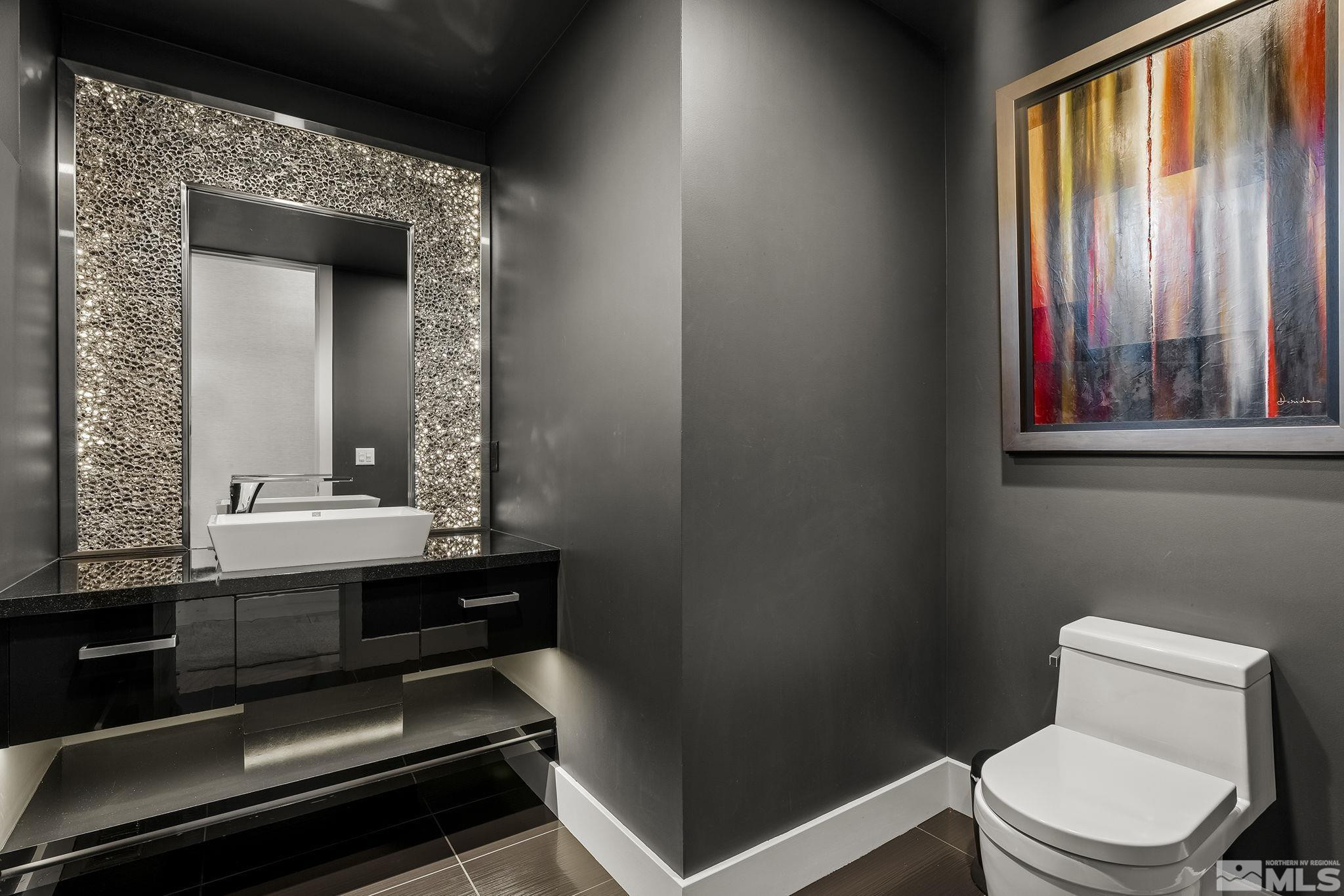 2385 Eagle Bend Trail Reno, NV 89523 - Photo 32 of 40 a bathroom with a toilet sink and mirror