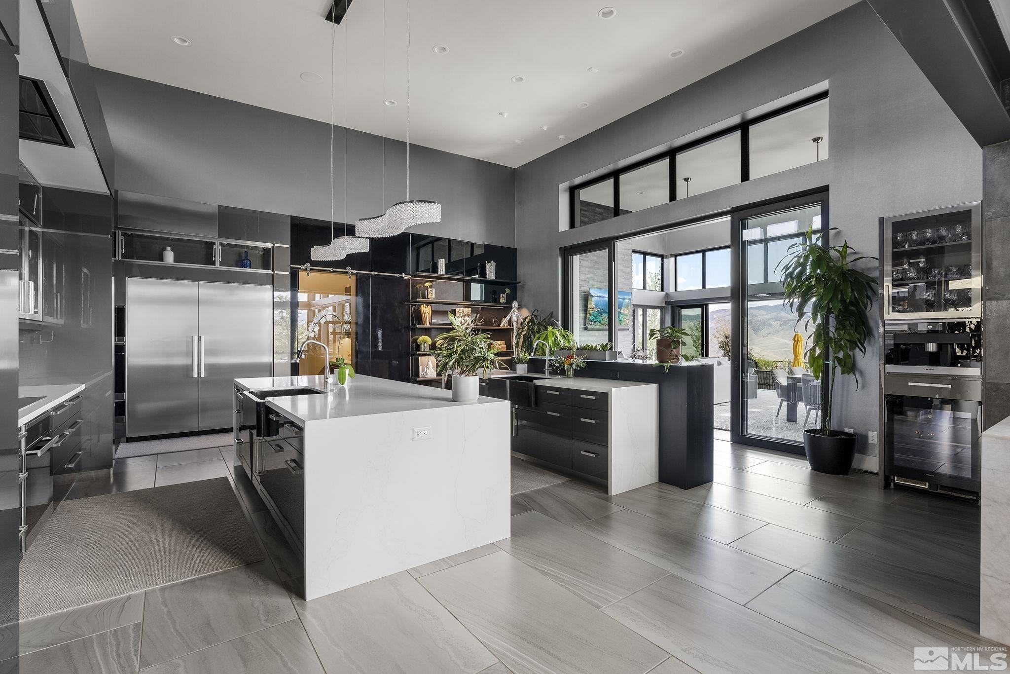 2385 Eagle Bend Trail Reno, NV 89523 - Photo 10 of 40 a kitchen with stainless steel appliances kitchen island granite countertop a stove and a refrigerator