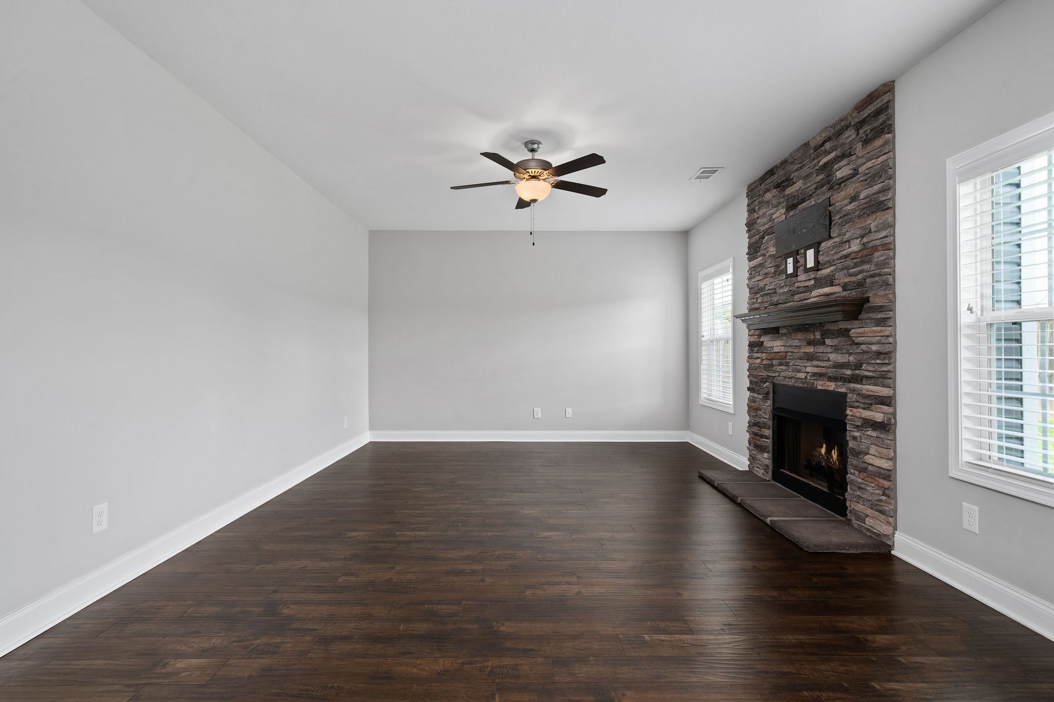 1008 Barnhill Road Clarksville, TN 37043 - Photo 12 of 44 wooden floor in an empty room with a fireplace