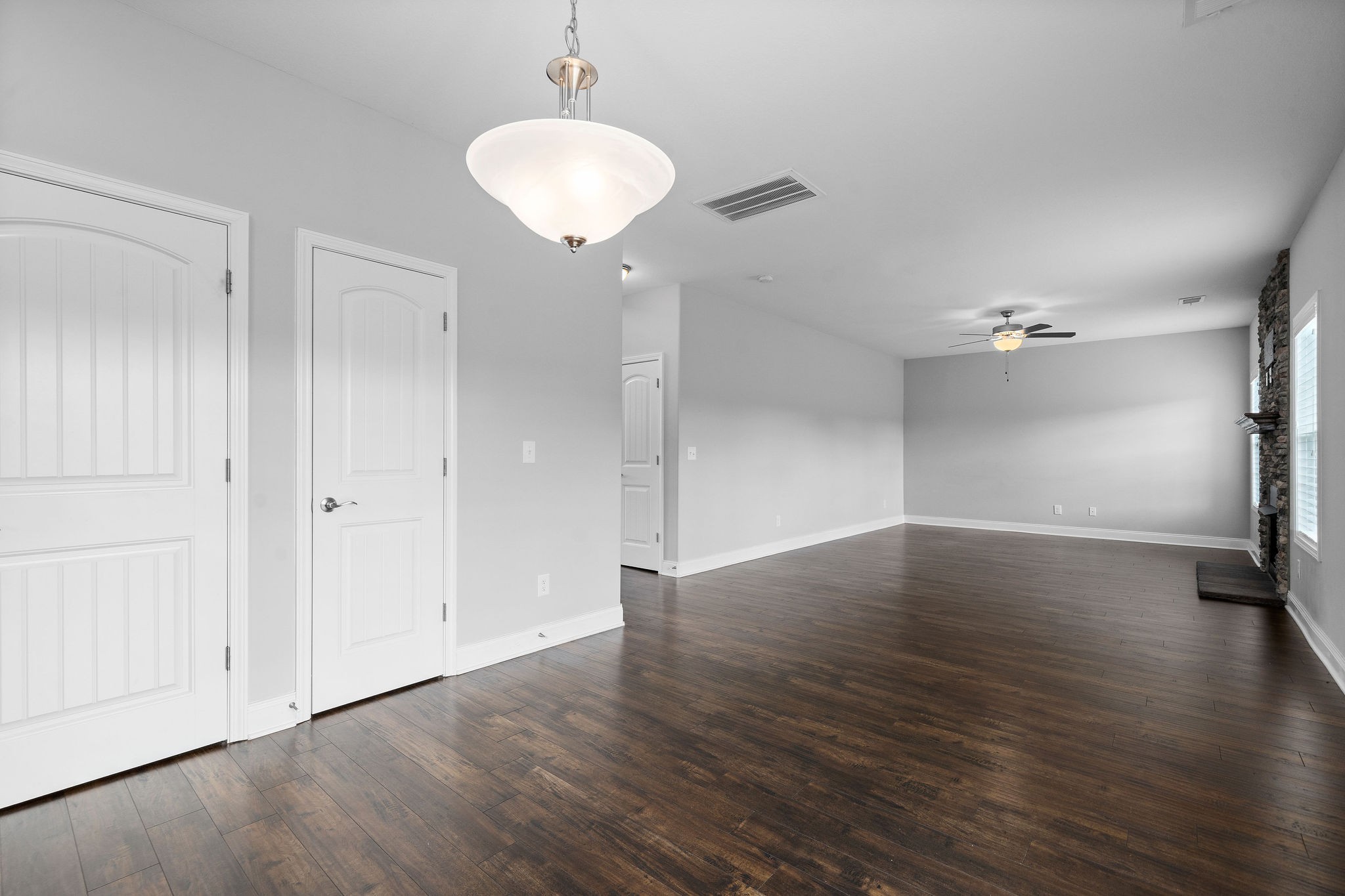 1008 Barnhill Road Clarksville, TN 37043 - Photo 14 of 44 an empty room with wooden floor and a ceiling fan