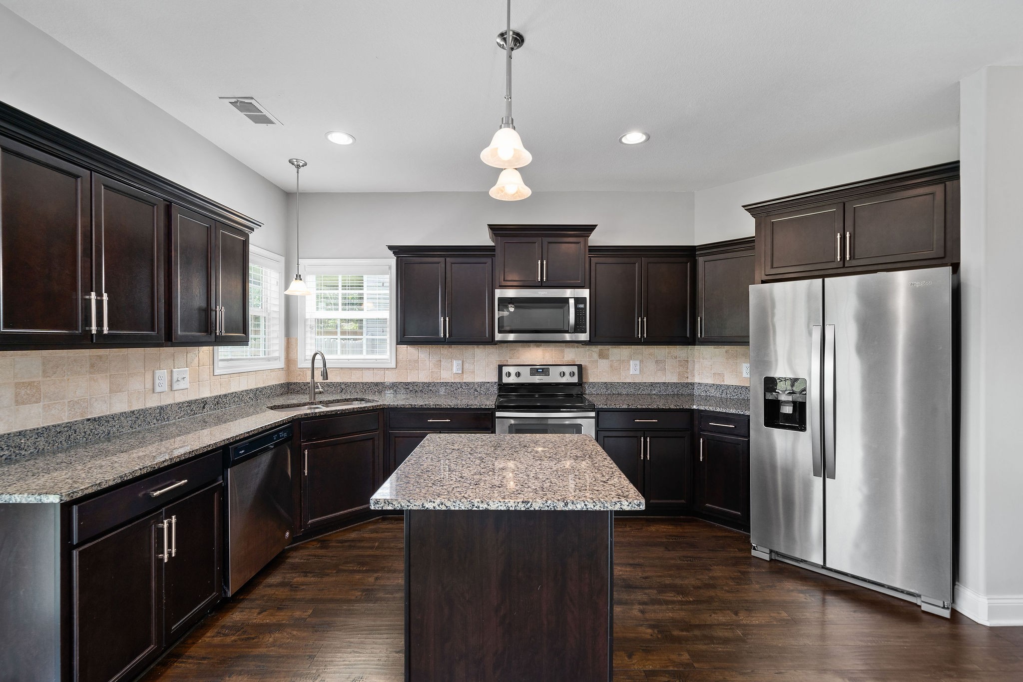 1008 Barnhill Road Clarksville, TN 37043 - Photo 18 of 44 a kitchen with a center island and stainless steel appliances