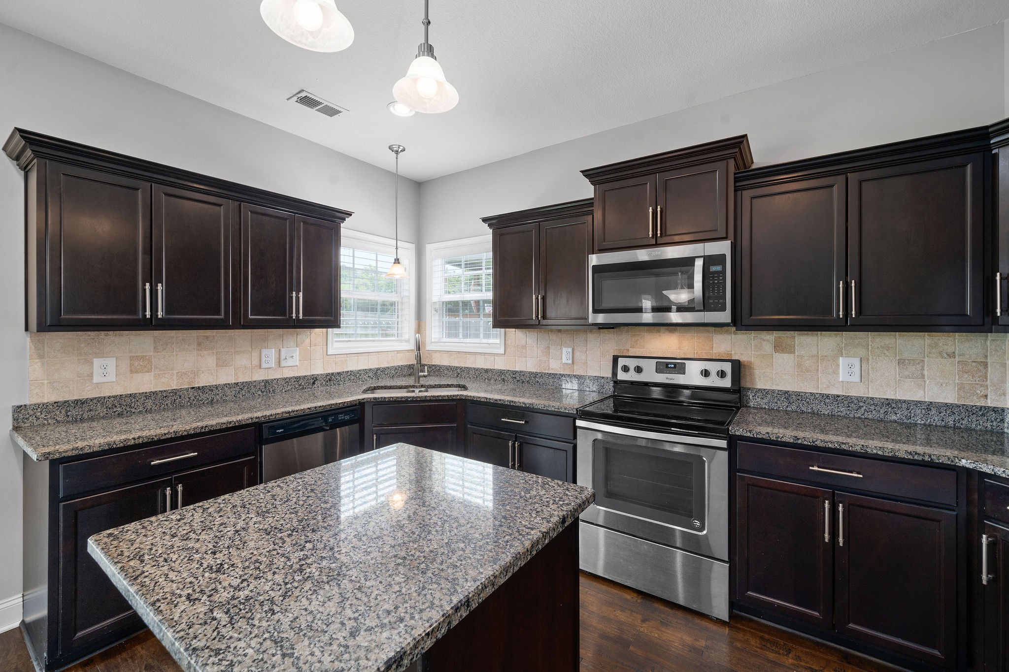 1008 Barnhill Road Clarksville, TN 37043 - Photo 20 of 44 a kitchen with granite countertop stainless steel appliances and wooden cabinets