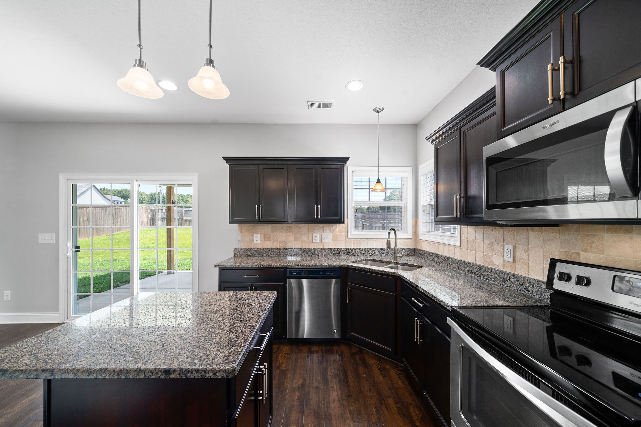 1008 Barnhill Road Clarksville, TN 37043 - Photo 21 of 44 a kitchen with stainless steel appliances granite countertop a sink and a stove