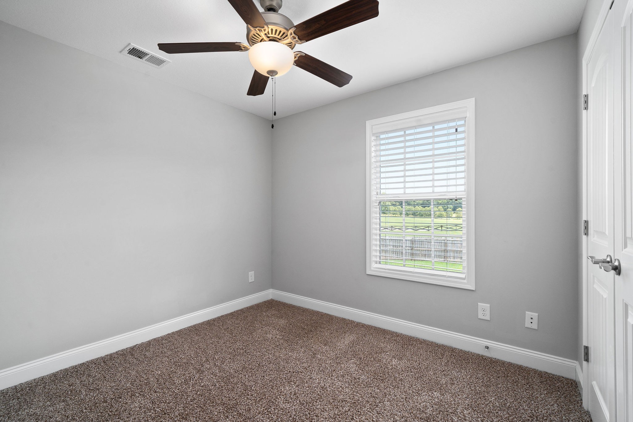 1008 Barnhill Road Clarksville, TN 37043 - Photo 35 of 44 an empty room with a window and a fan