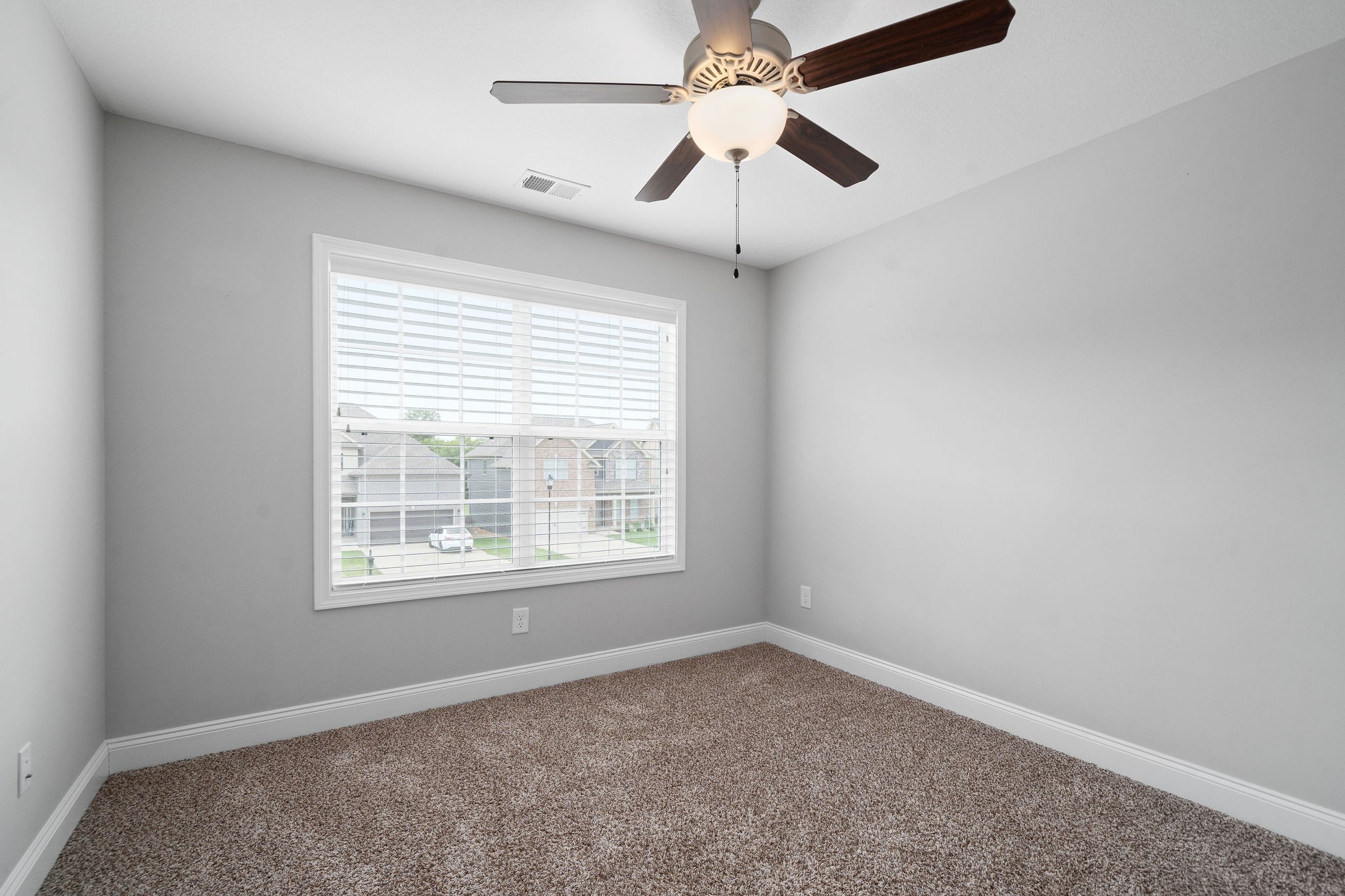 1008 Barnhill Road Clarksville, TN 37043 - Photo 36 of 44 an empty room with a window and a fan