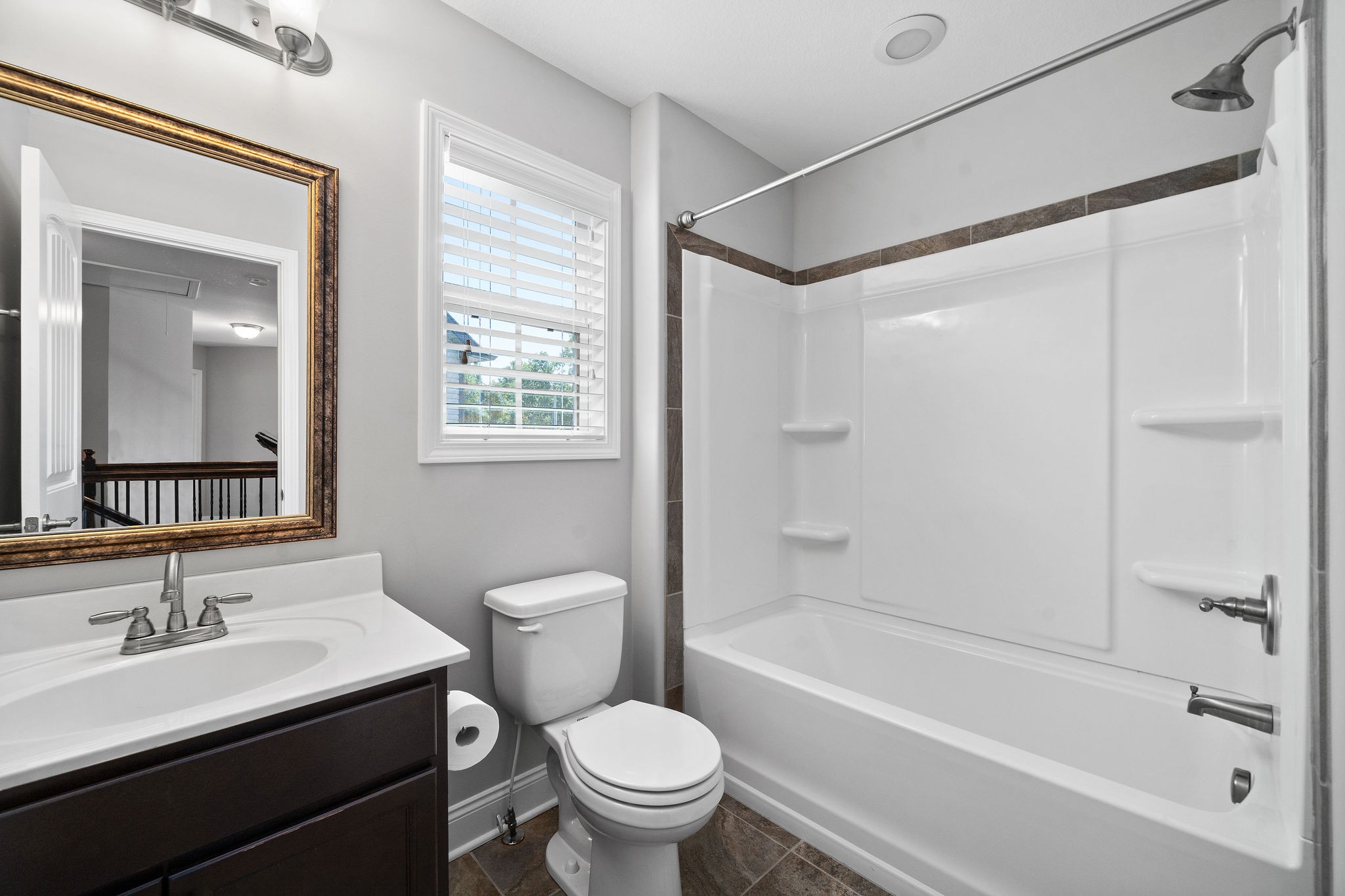 1008 Barnhill Road Clarksville, TN 37043 - Photo 37 of 44 a bathroom with a bathtub shower sink vanity mirror and toilet