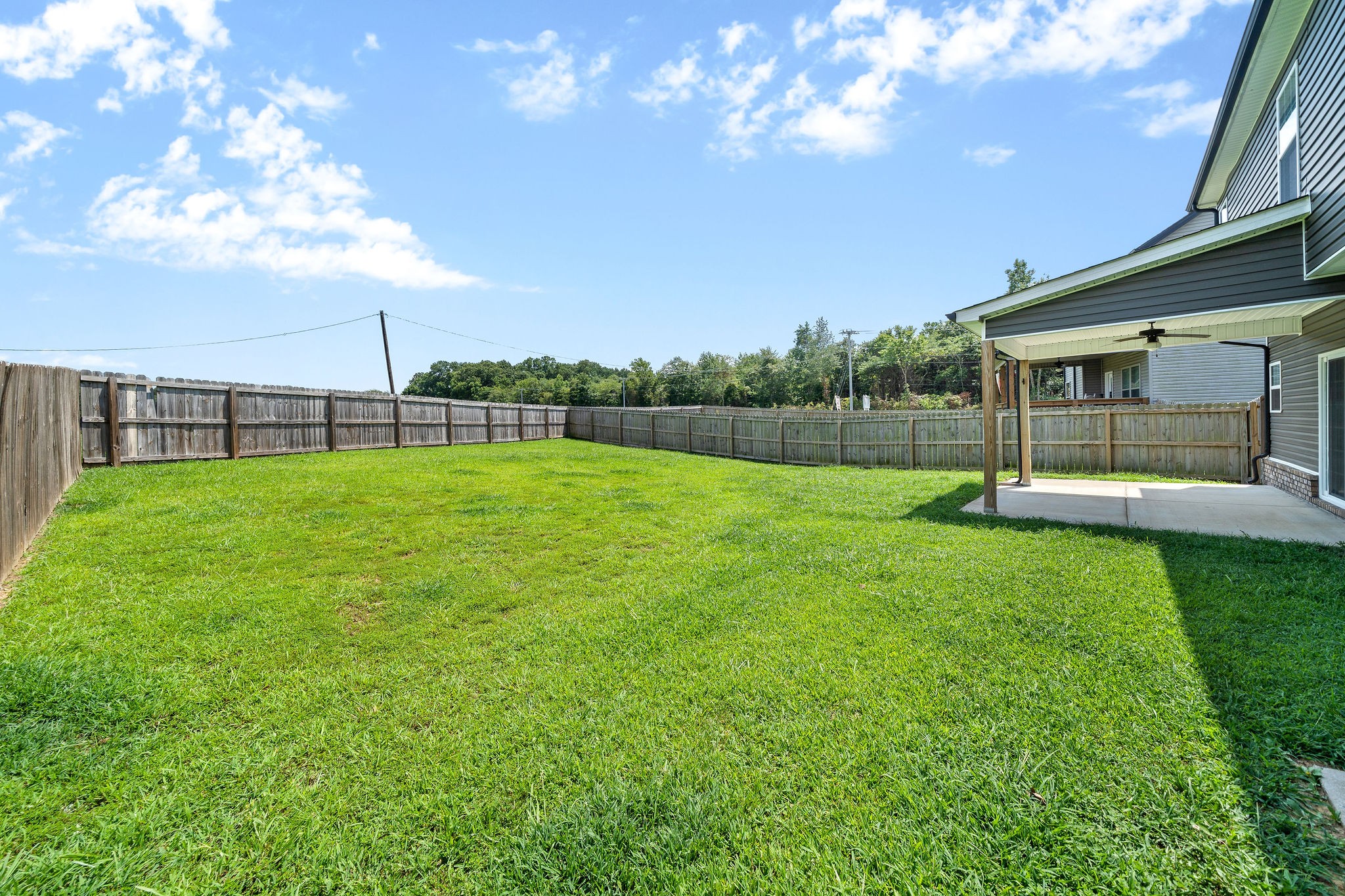 1008 Barnhill Road Clarksville, TN 37043 - Photo 43 of 44 a view of a house with a backyard and a patio