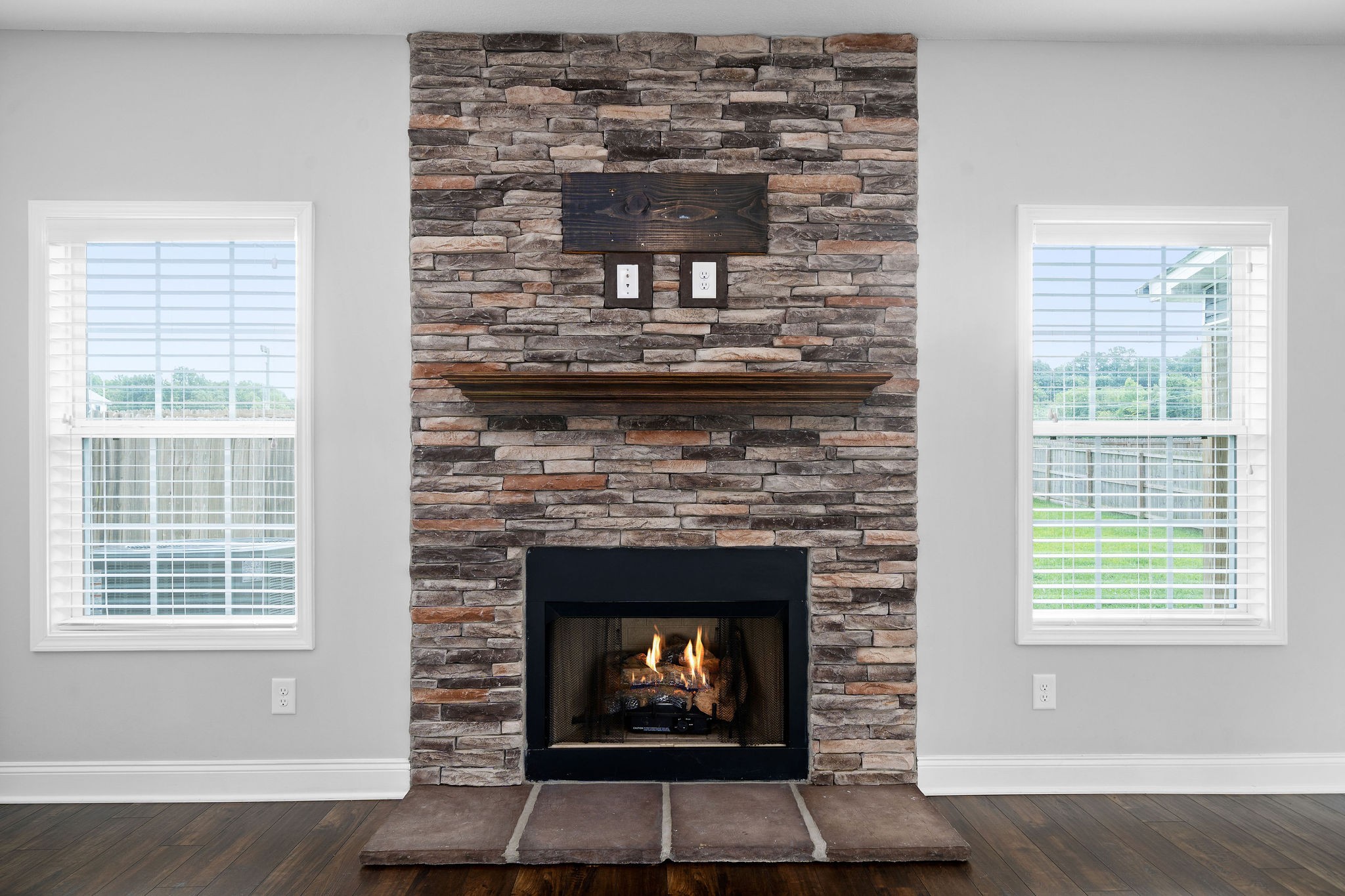 1008 Barnhill Road Clarksville, TN 37043 - Photo 10 of 44 a living room with a fireplace and windows