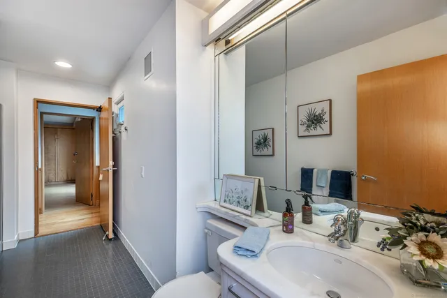 a bedroom with a bed and a cabinets