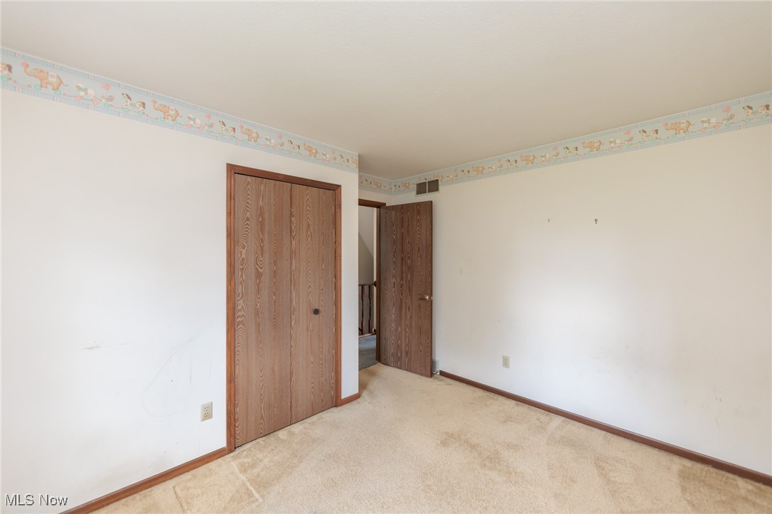 3324 Marsh Road Stow, OH 44224 - Photo 28 of 33 Unfurnished bedroom with a closet and carpet flooring