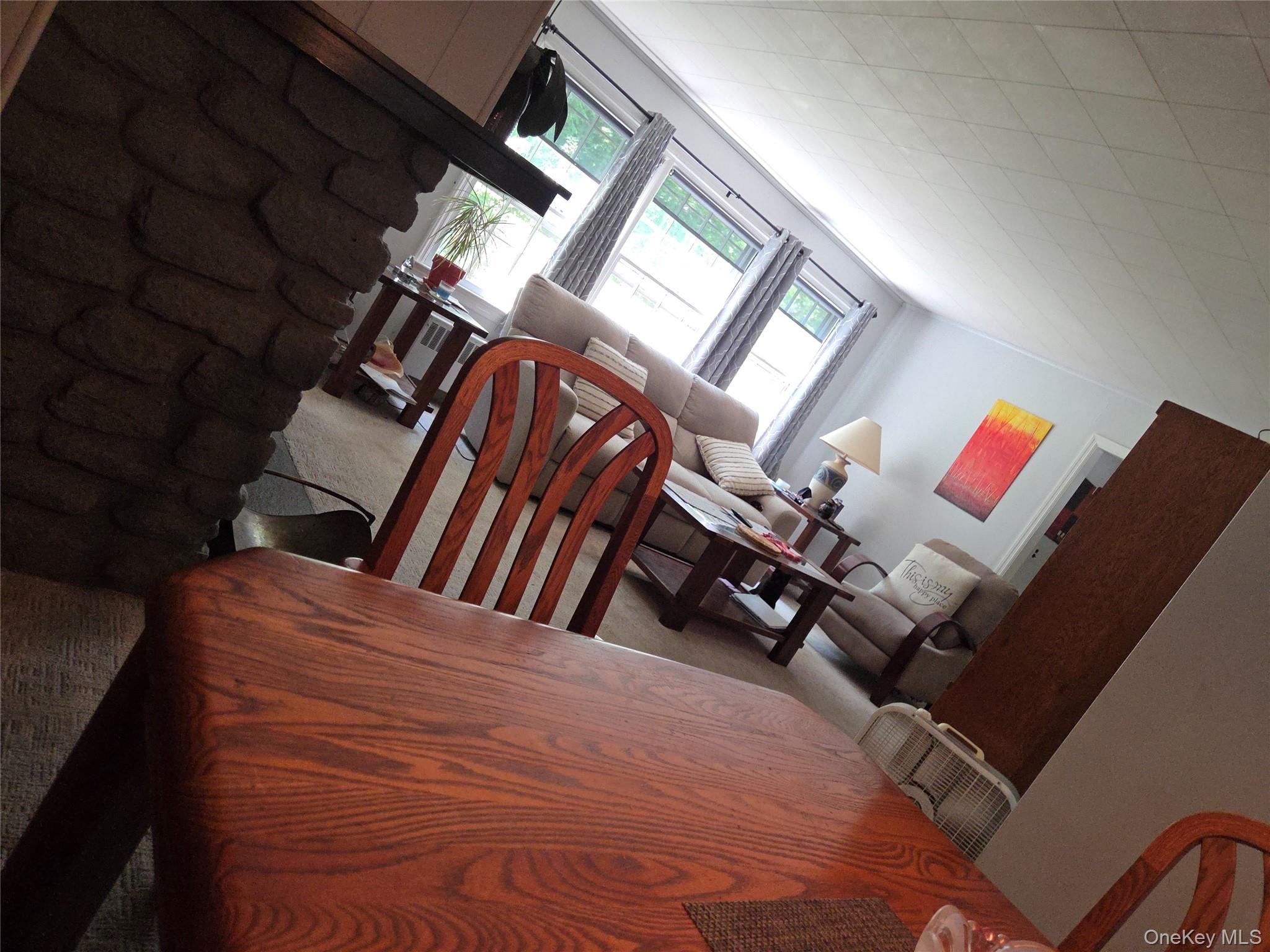 342 Coldenham Road Walden, NY 12586 - Photo 14 of 20 a view of an empty room with wooden floor and windows