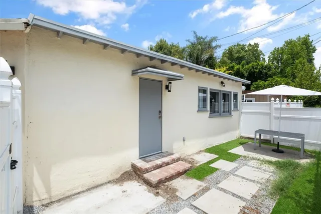 a backyard of a house with seating space