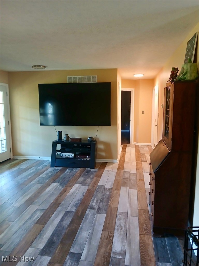 1685 Fattler Ridge Road Philo, OH 43771 - Photo 14 of 24 Living room featuring baseboards and wood-type flooring