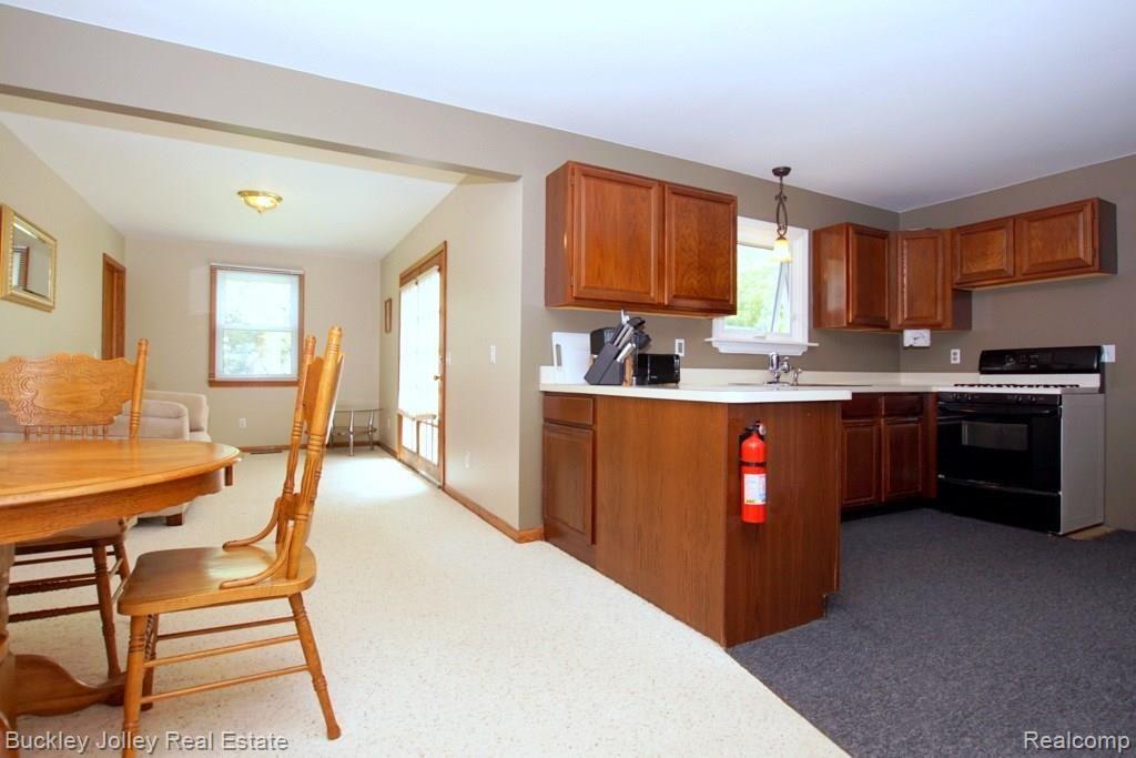 1748 Peavy Road Howell, MI 48843 - Photo 4 of 22 Dining Area Opens into the Den Area