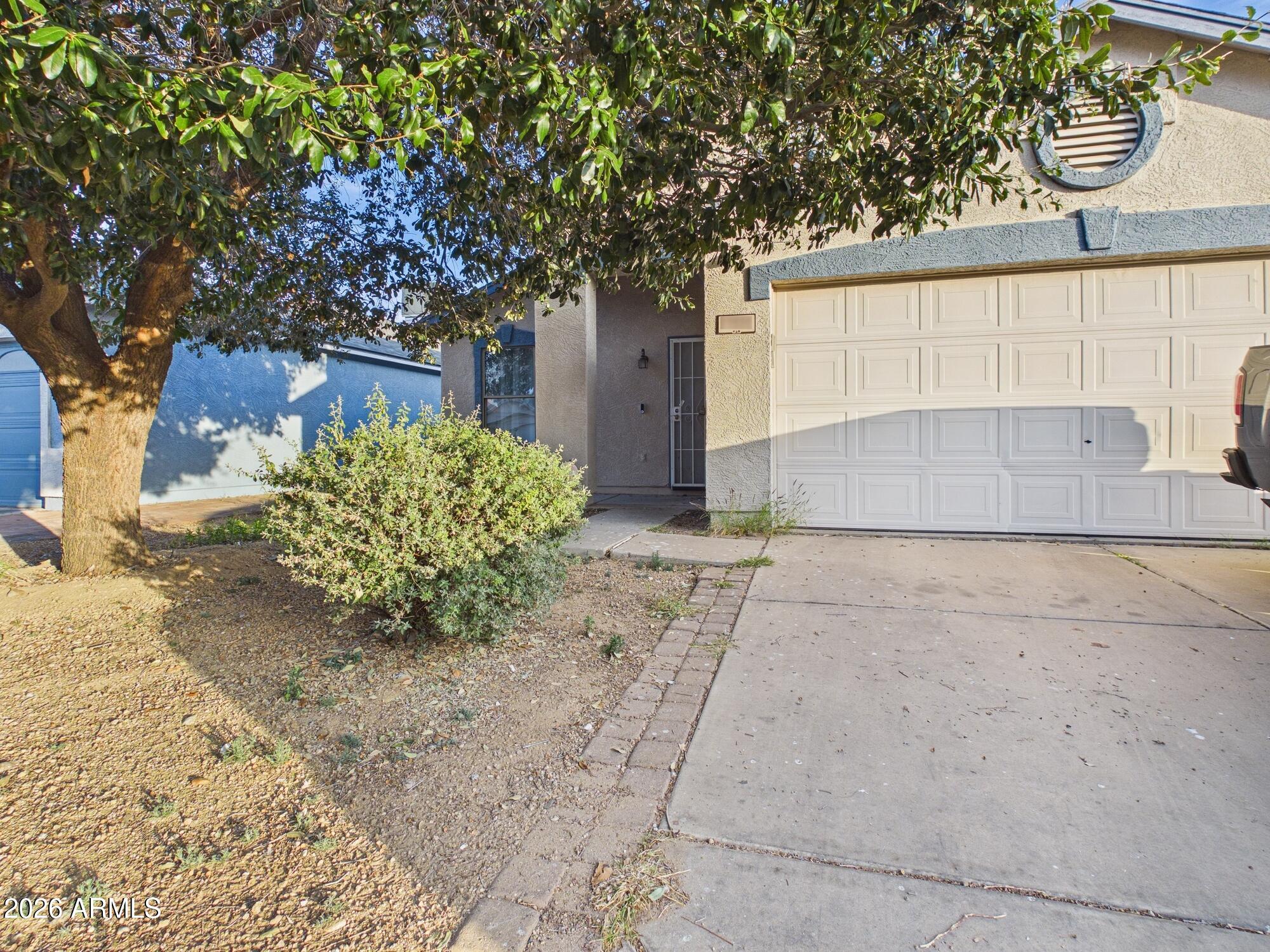 11534 West Bloomfield Road El Mirage, AZ 85335 - Photo 9 of 10 2-Car Garage + Shade Tree