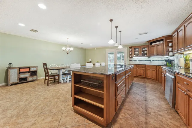 a kitchen with stainless steel appliances a sink and cabinets