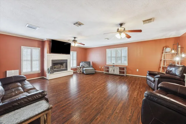 a living room with furniture fireplace and flat screen tv