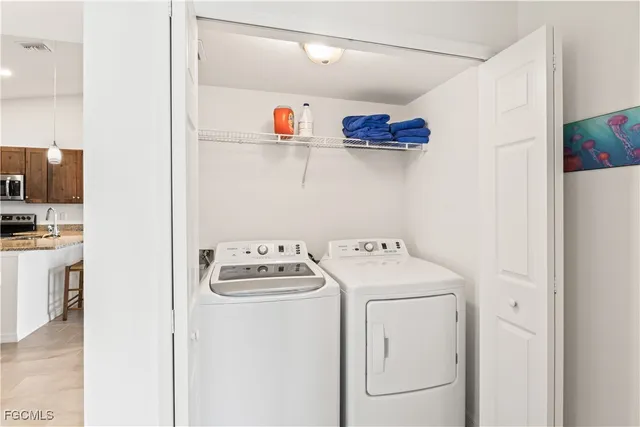 a utility room with dryer and washer