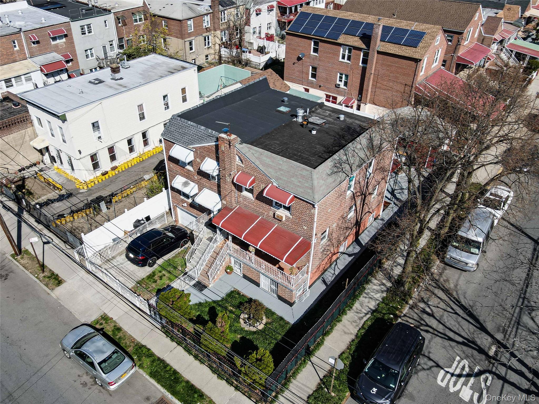 993 Duncan Street Bronx, NY 10469 - Photo 1 of 32 an aerial view of multiple houses with yard