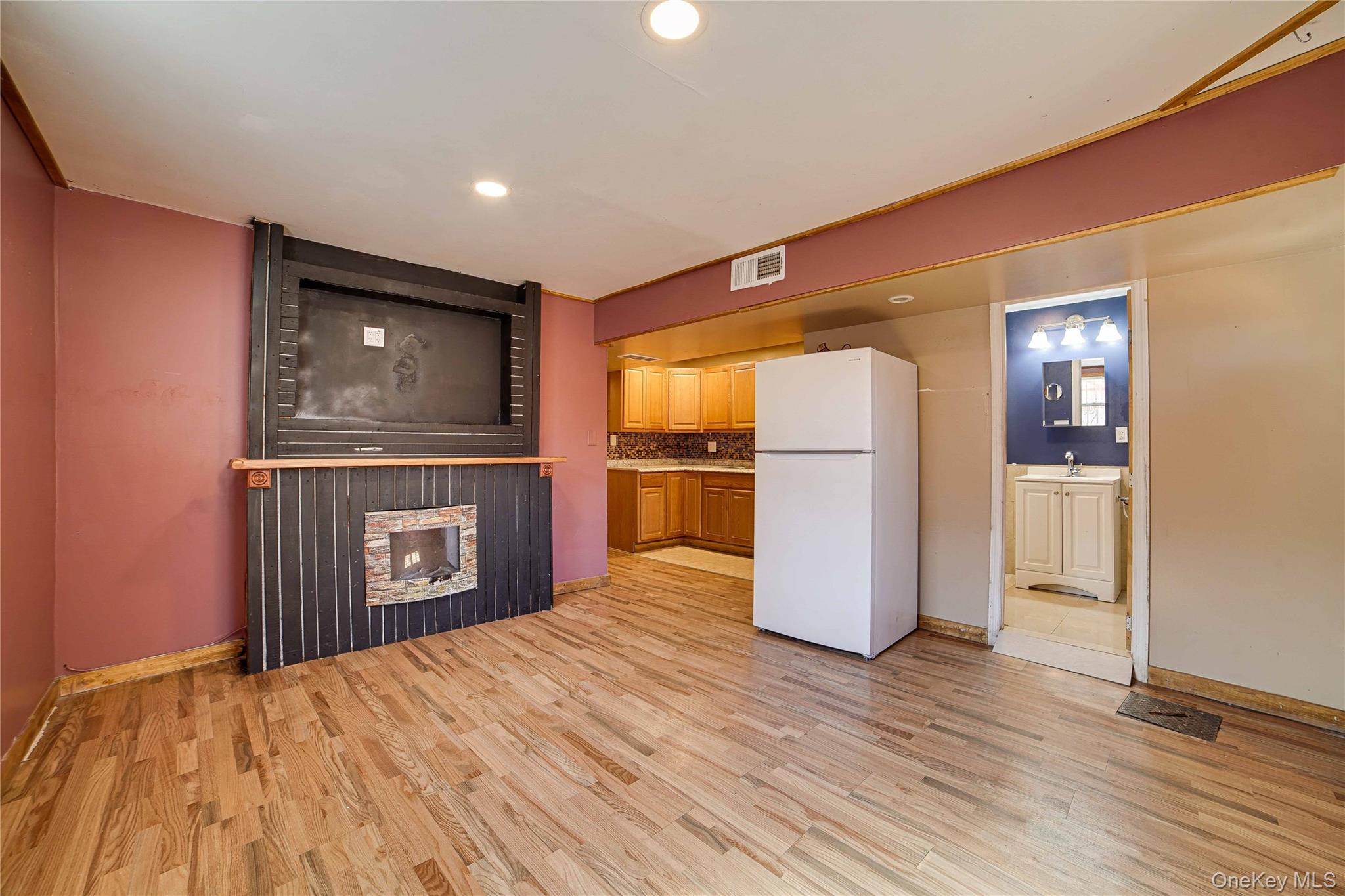 993 Duncan Street Bronx, NY 10469 - Photo 25 of 32 a open kitchen with a refrigerator and microwave