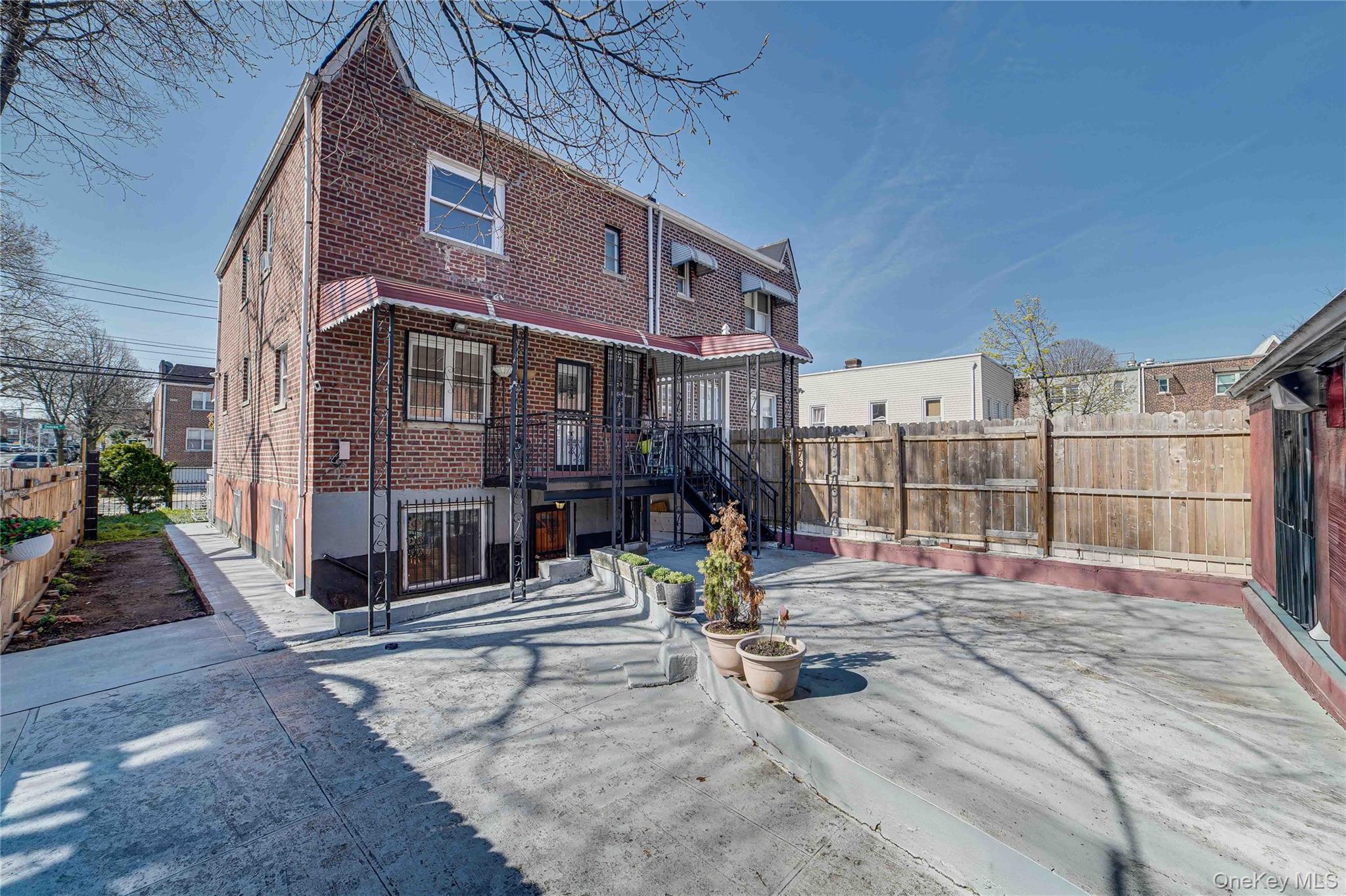 993 Duncan Street Bronx, NY 10469 - Photo 30 of 32 a view of a building with a patio